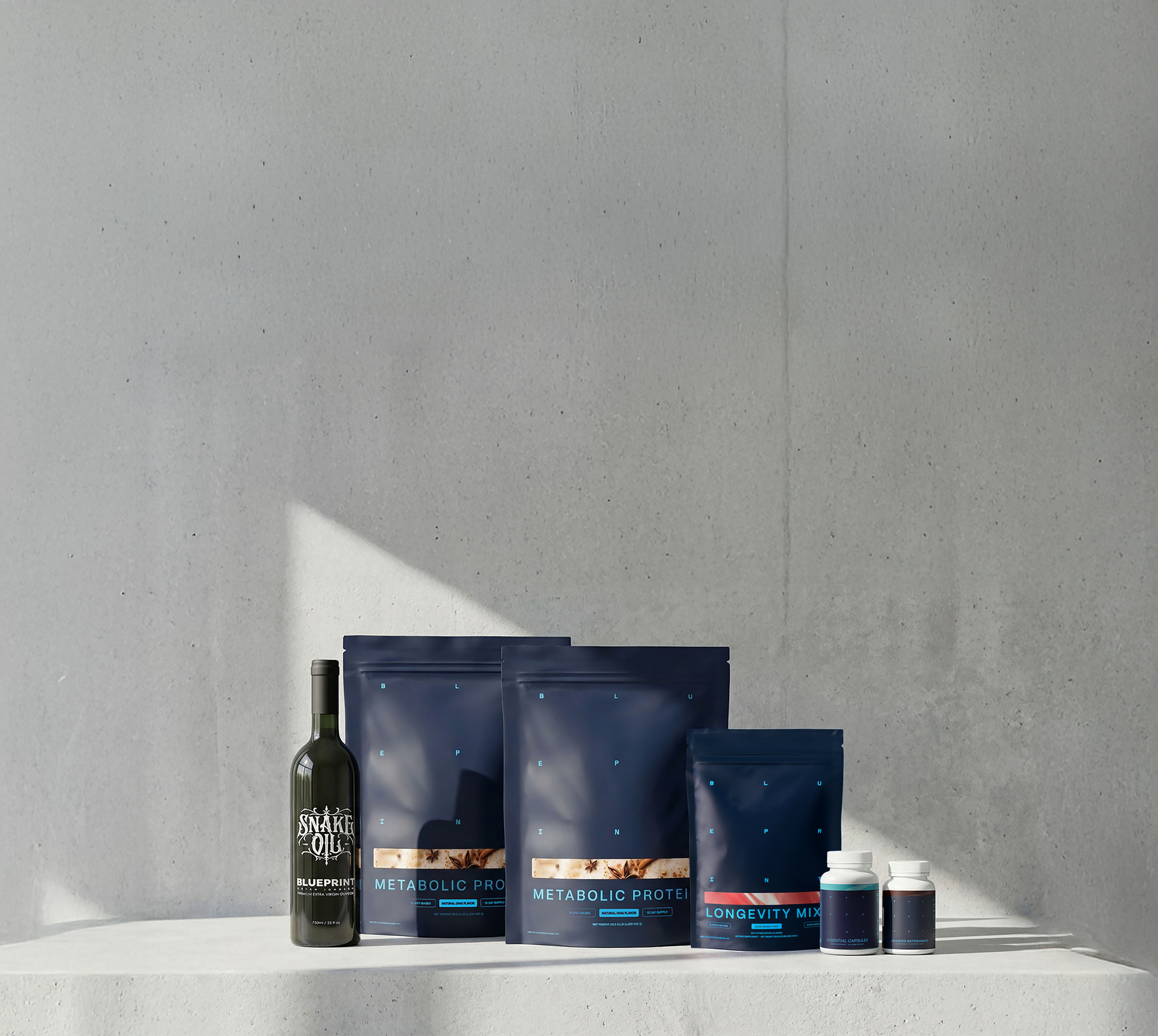 Collection of health and wellness products on a gray surface with a concrete wall background