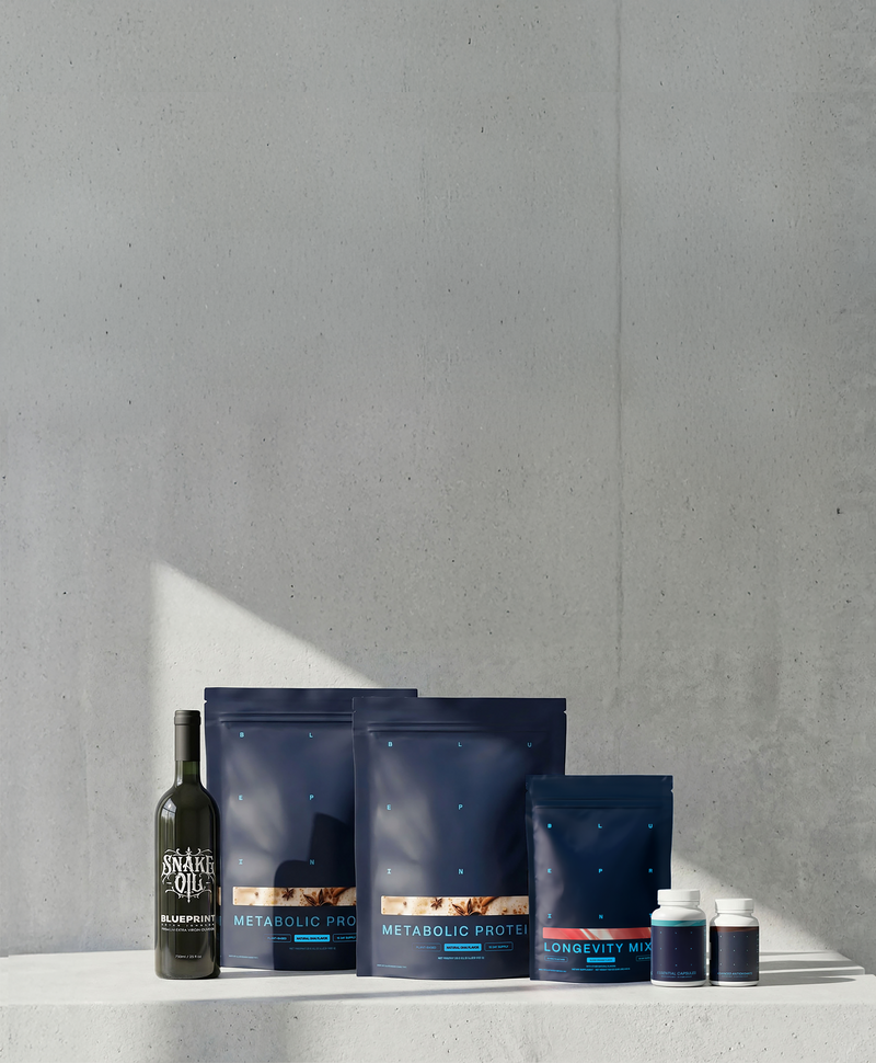 Supplement products including bottles and bags on a gray surface with a gray background
