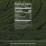 Nutrition facts label for a green tea product on a green leafy background