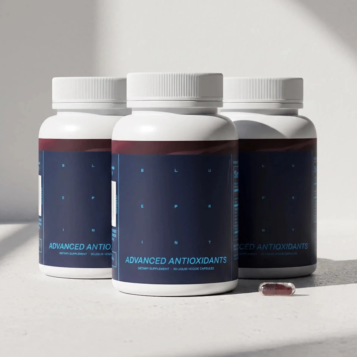 Three bottles of Blueprint Advanced Antioxidants supplement in a three-pack