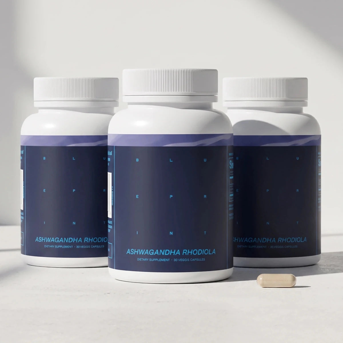 Three bottles of Blueprint Ashwagandha and Rhodiola supplement for stress support and recovery