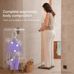 Woman on a smart scale viewing segmental body composition results for Blueprint longevity tracking