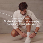 Man stretching at home after a workout, part of Blueprint exercise and longevity guidance