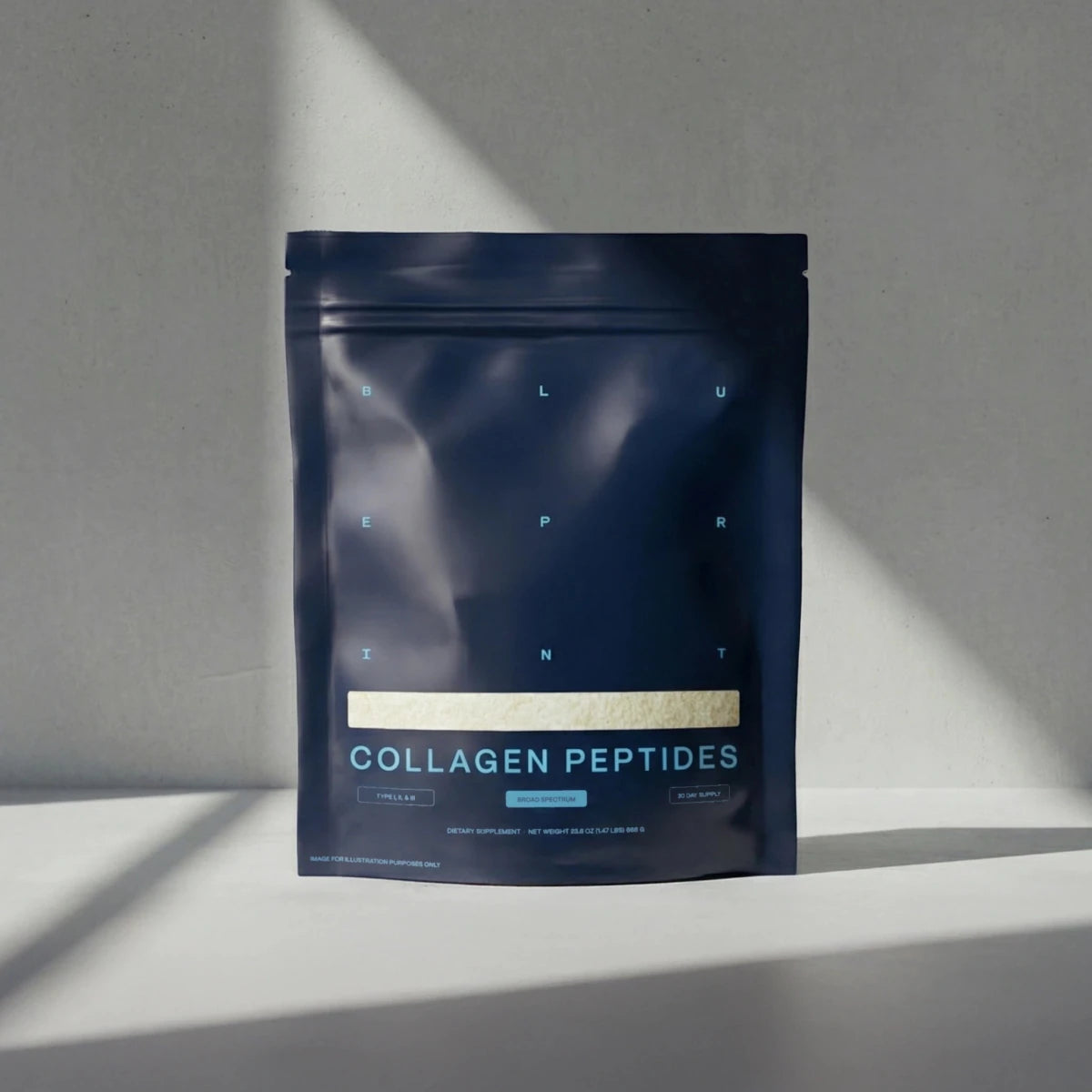 Dark blue package of collagen peptides on a gray background