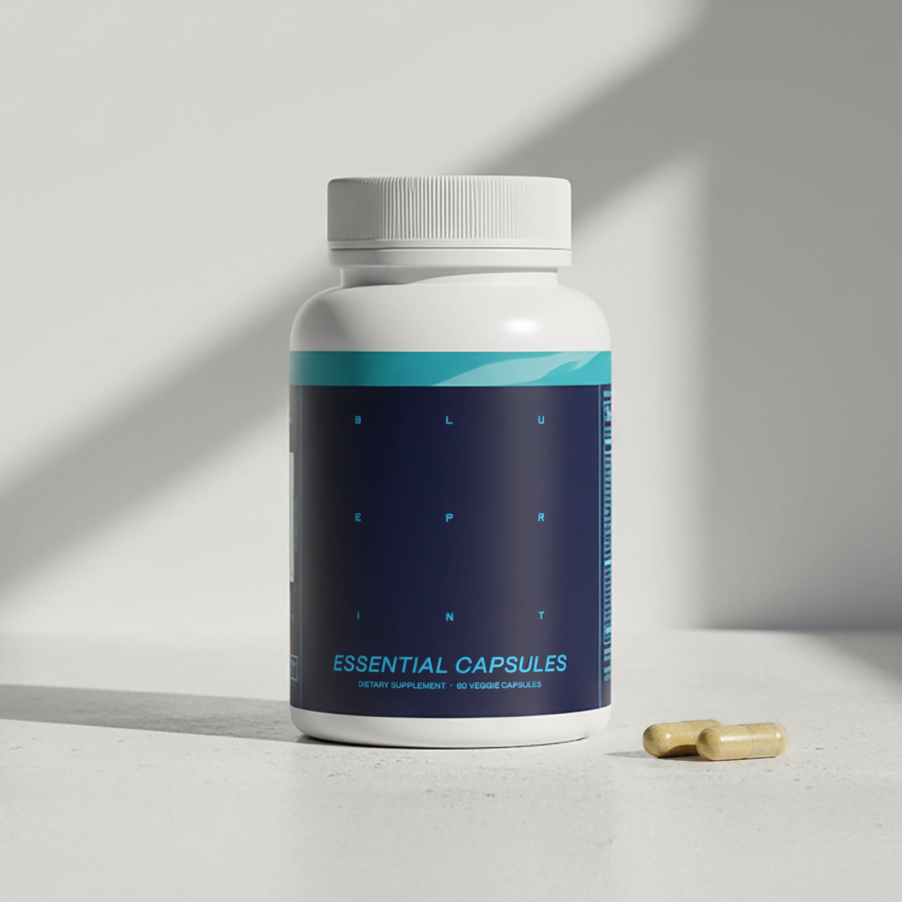 Supplement bottle labeled 'Essential Capsules' with a pill on a light surface