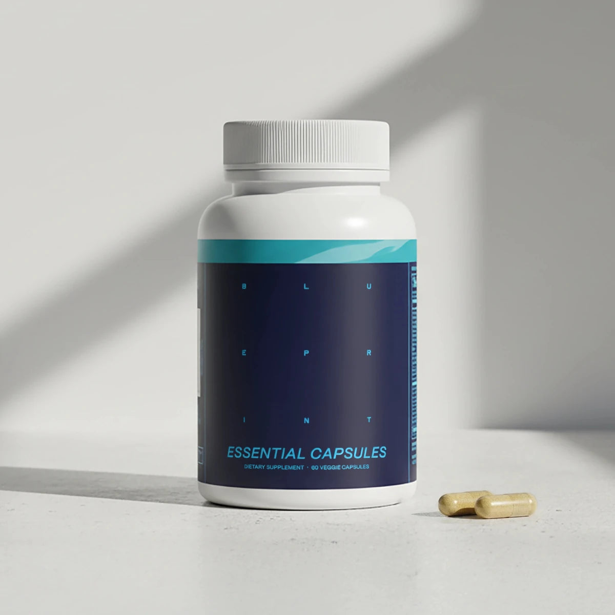 Supplement bottle labeled 'Essential Capsules' with a pill on a light surface
