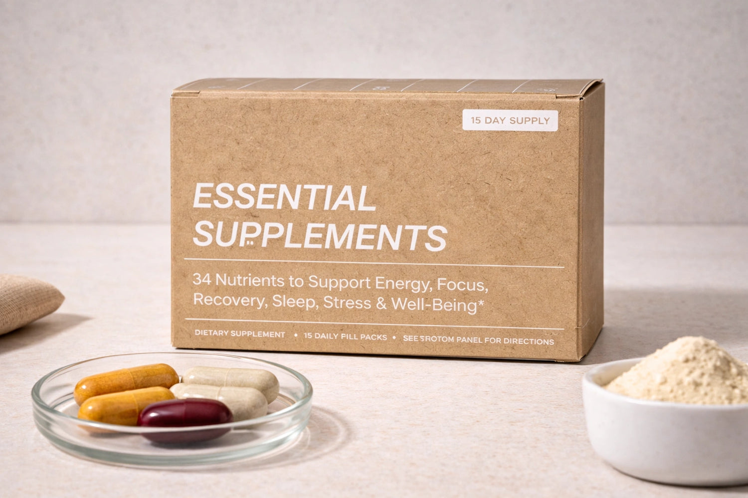 Box of 'Essential Supplements' with supplements on a neutral background