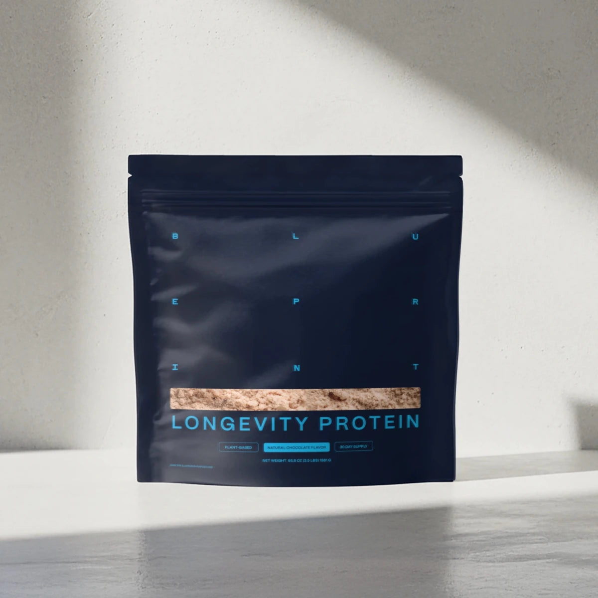 Protein package labeled 'Longevity Protein' on a neutral background