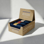 Box of Macadamia Protein Bars on a light gray background