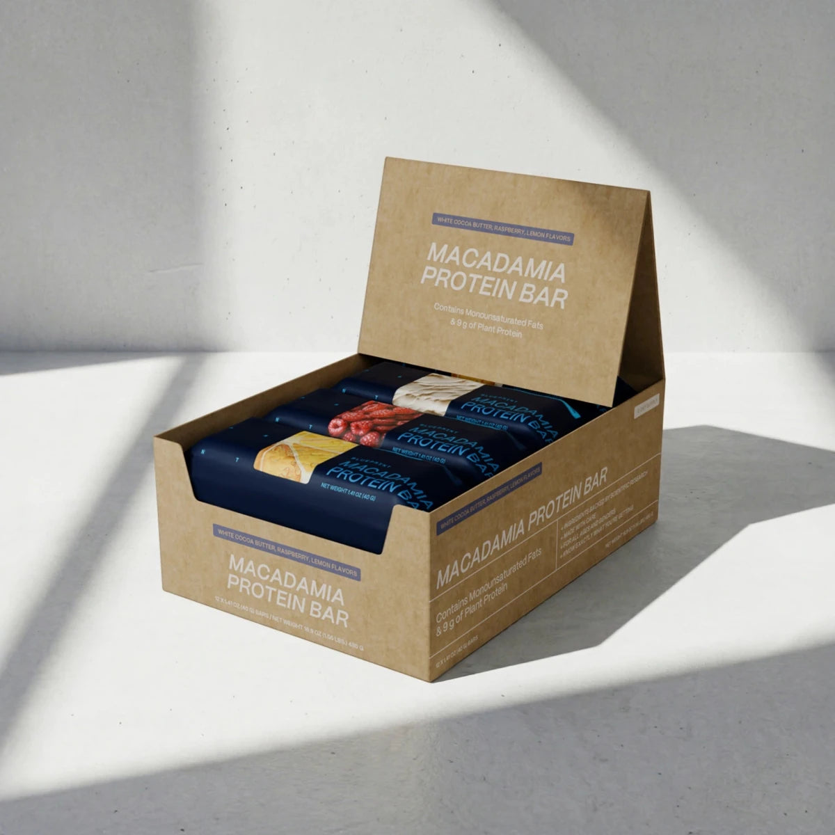 Box of Macadamia Protein Bars on a light gray background