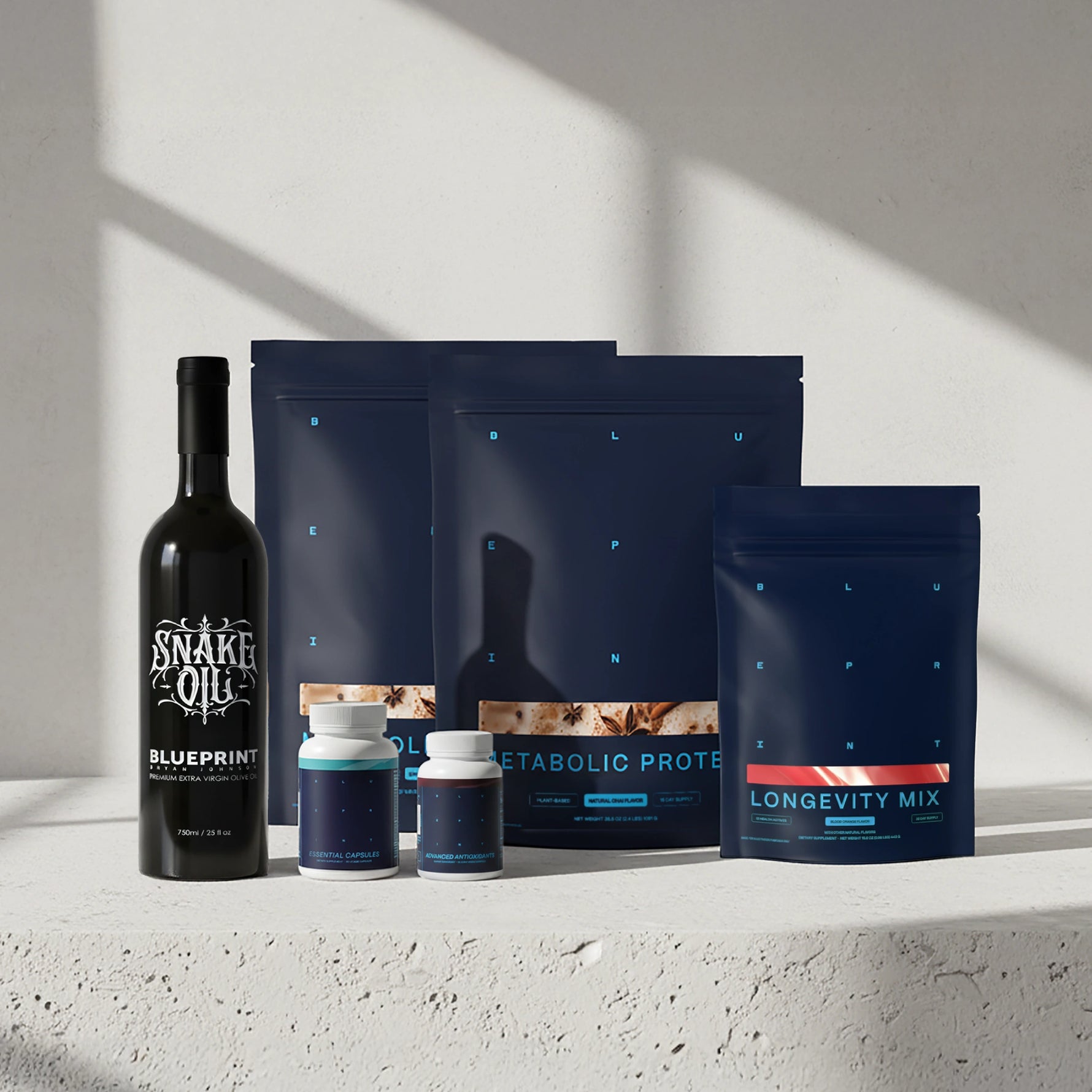 Collection of health and wellness products including a bottle and packages on a light background