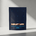 Navy blue package of Metabolic Protein on a light gray background 
