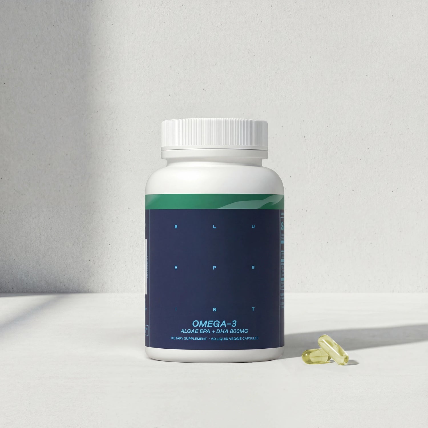 Omega-3 supplement bottle with capsules on a light gray background