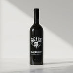 Black bottle of Snake Oil Blueprint on a white background 