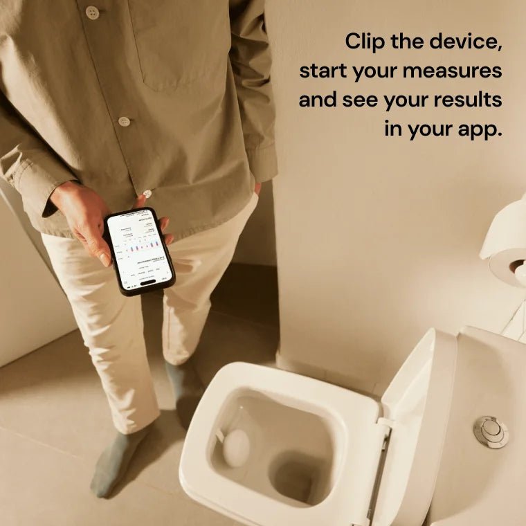Clipping the U-Scan device into the toilet to start at-home biomarker measurements