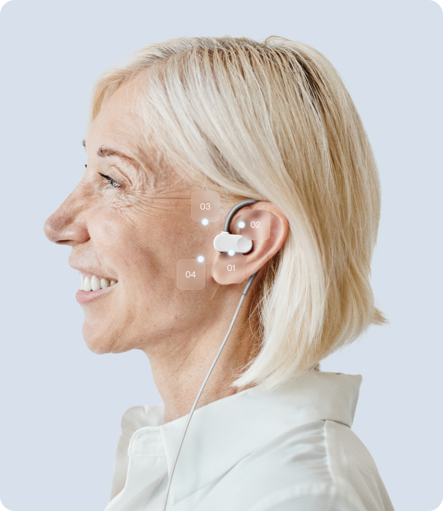 Smiling older woman wearing a discreet in-ear health monitoring device, Blueprint longevity