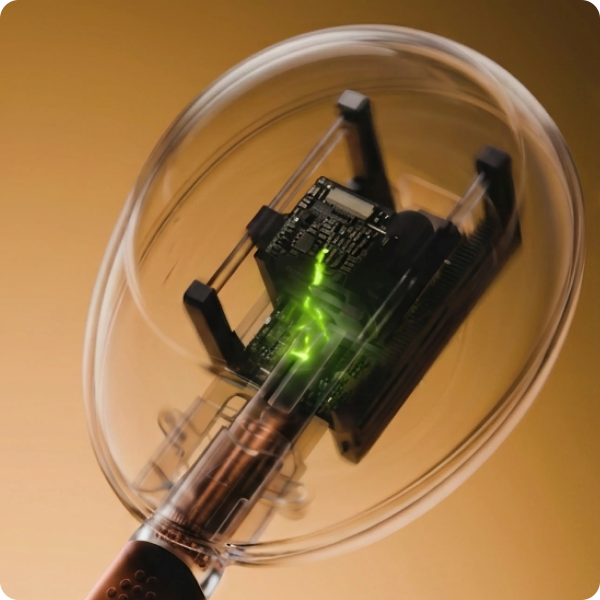Close-up of the Mira monitor sensor reading a hormone test wand with green laser light