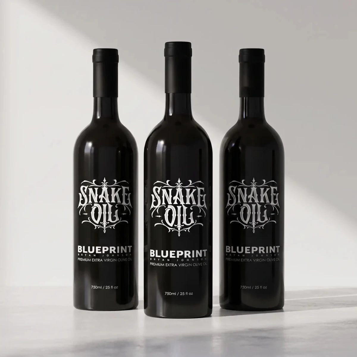 Blueprint Snake Oil extra virgin olive oil three-pack of black bottles