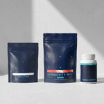 Three supplement packages labeled 'Creatine', 'Longevity Mix', and 'Essential Capsules' on a gray background.