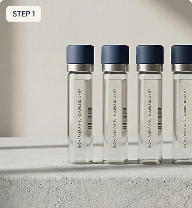 Four clear sample bottles with blue caps on a light gray surface.