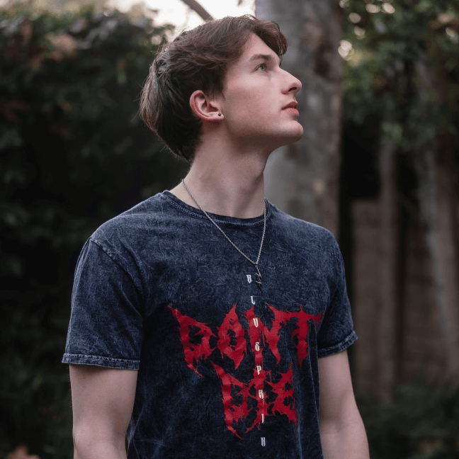 Lifestyle image of boy wearing 'Don't Die' grunge T-shirt 