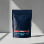 Blueprint Longevity Mix pouch standing on a sunlit white surface