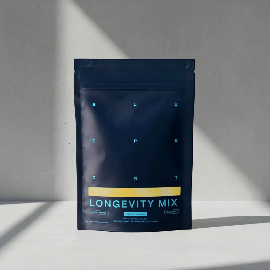 Blueprint Longevity Mix pouch on a sunlit white surface, a daily longevity drink mix