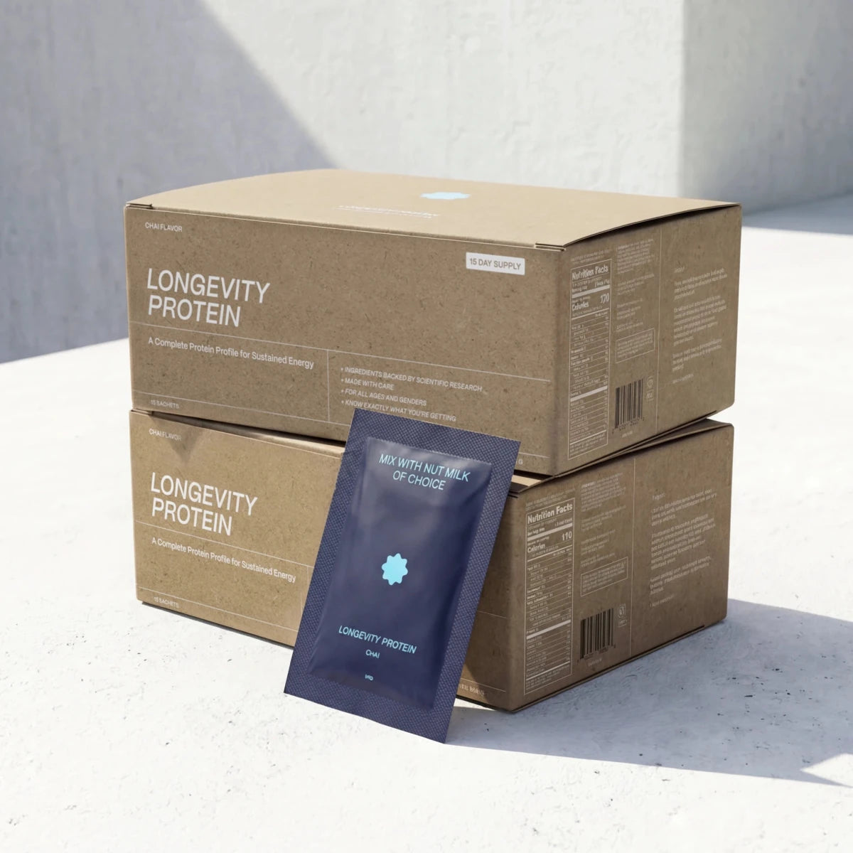 Longevity Protein packaging with a cardboard box and a single sachet on a light background