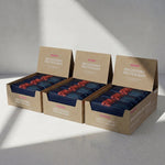 Three boxes of Blueprint Raspberry macadamia bars in a three-pack
