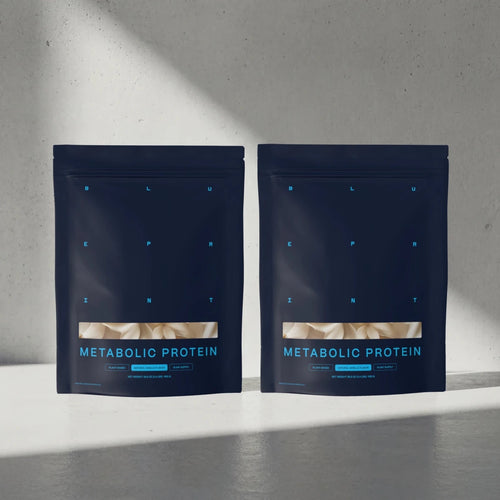 Two packages of Metabolic Protein on a gray surface with a light gray background #vanilla_30-day