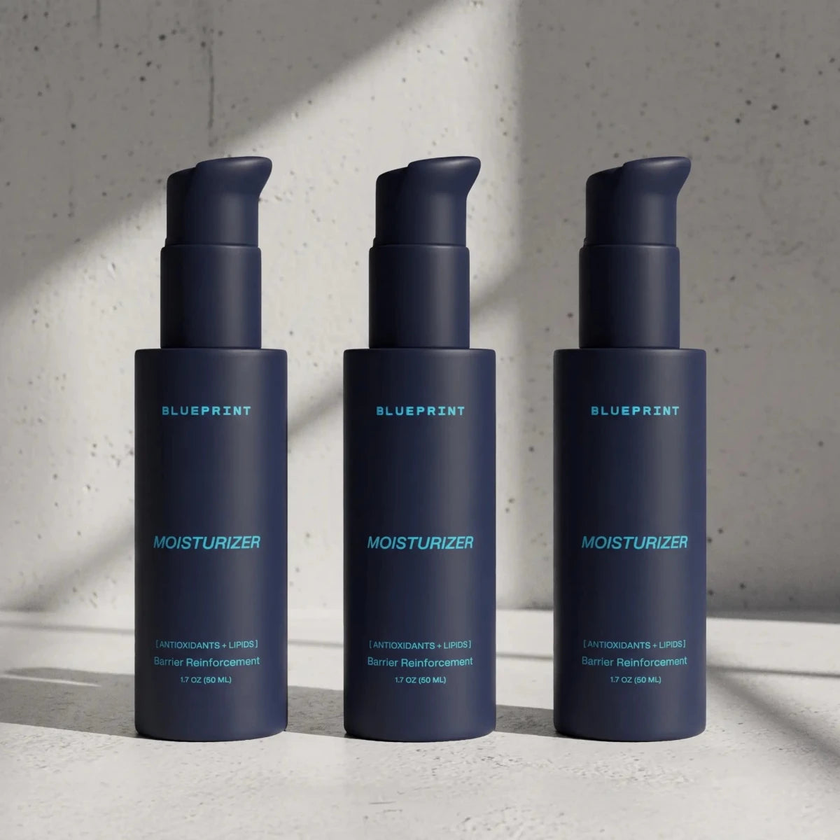 Three bottles of Blueprint Moisturizer from the longevity skincare line