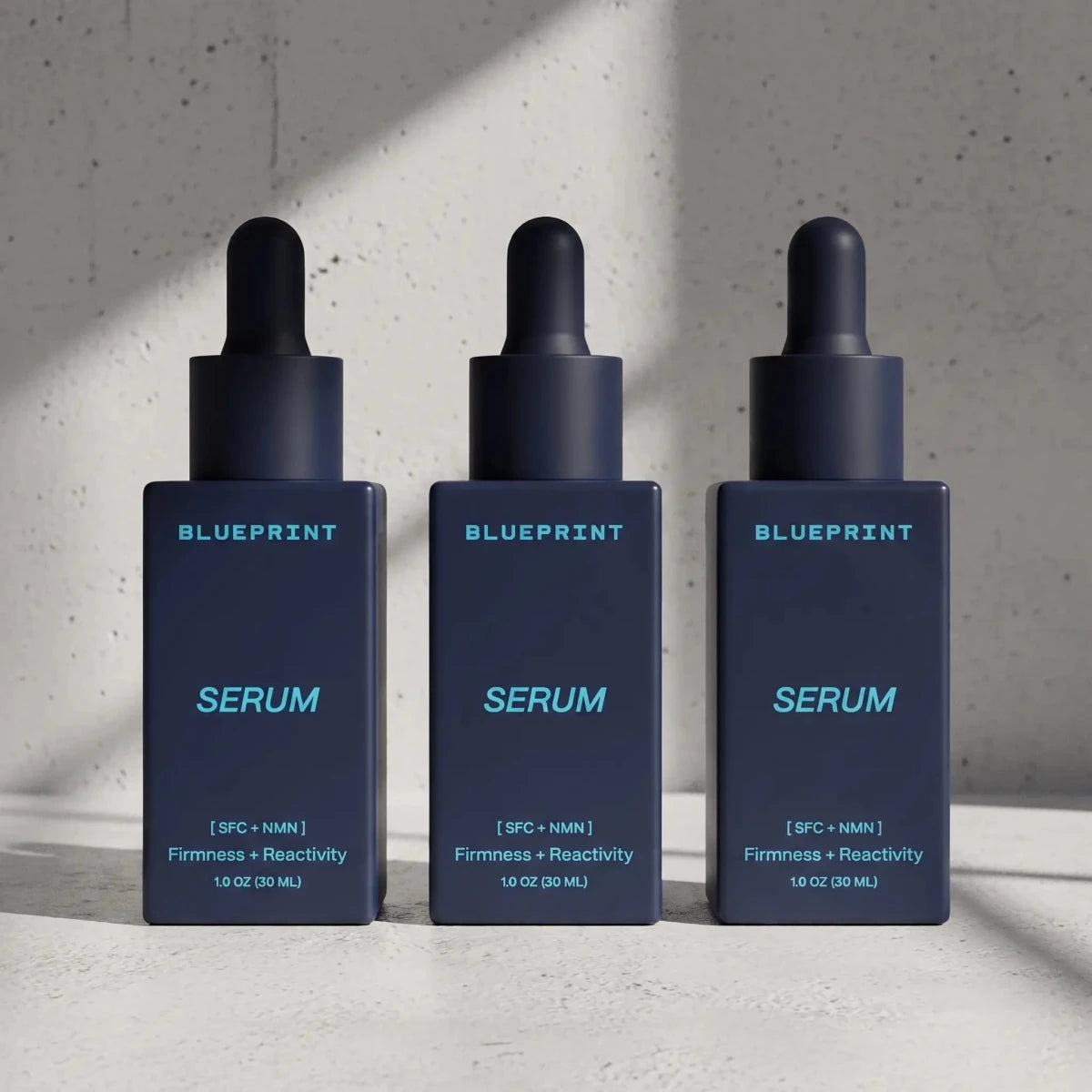 Three dropper bottles of Blueprint Serum from the longevity skincare line