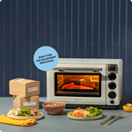 Tovala countertop oven built for the Blueprint protocol, with plated meals and shipping boxes