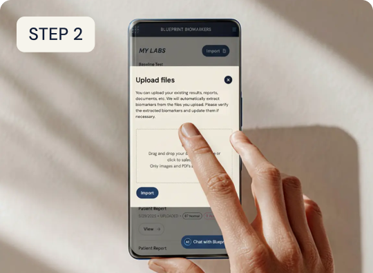 Hand using a smartphone with an app interface on a light background