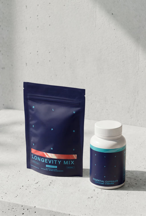 Longevity Mix package and bottle on a concrete surface with a gray background